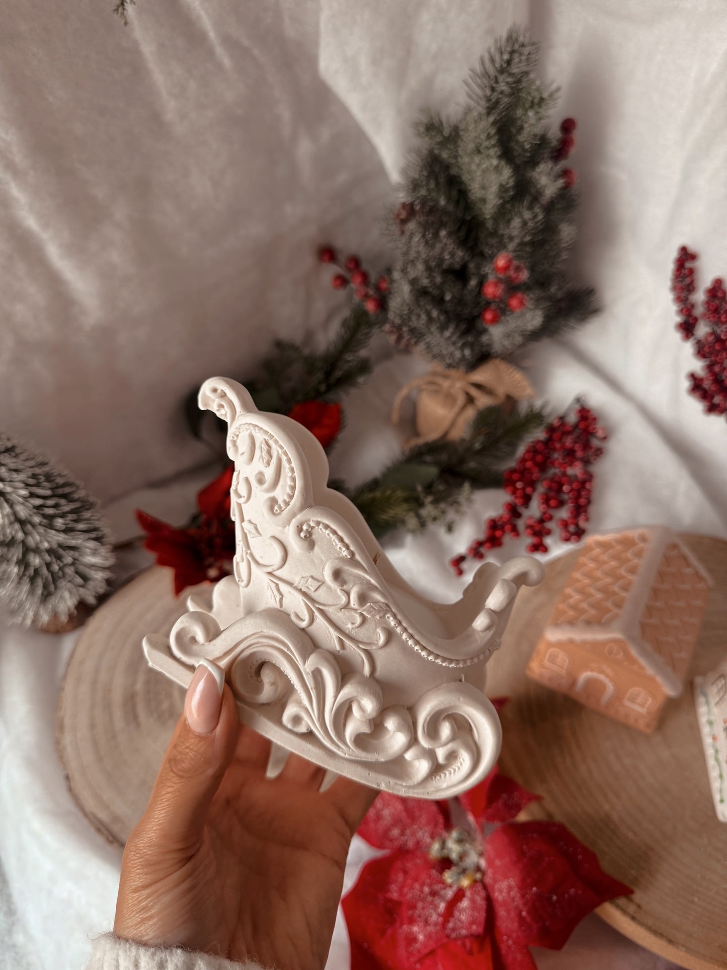 Bougie traîneau fait main en jesmonite senteur au choix